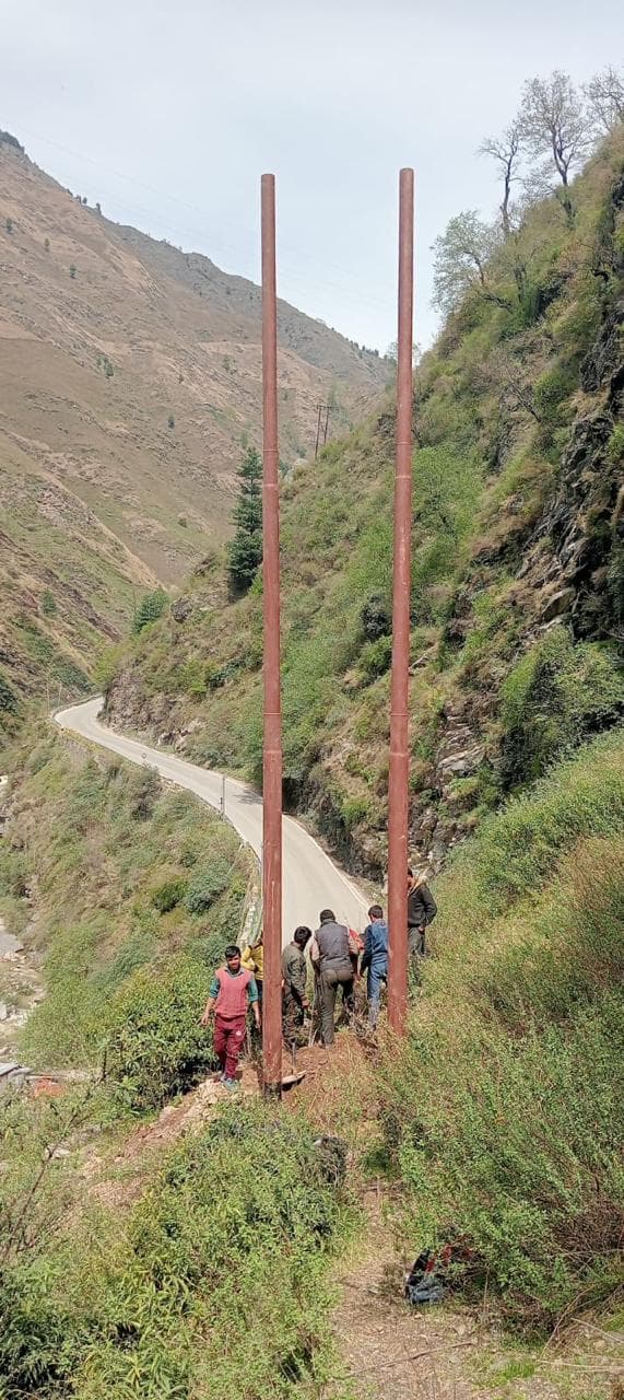 Transmission poles mountain road — WanX Infra project